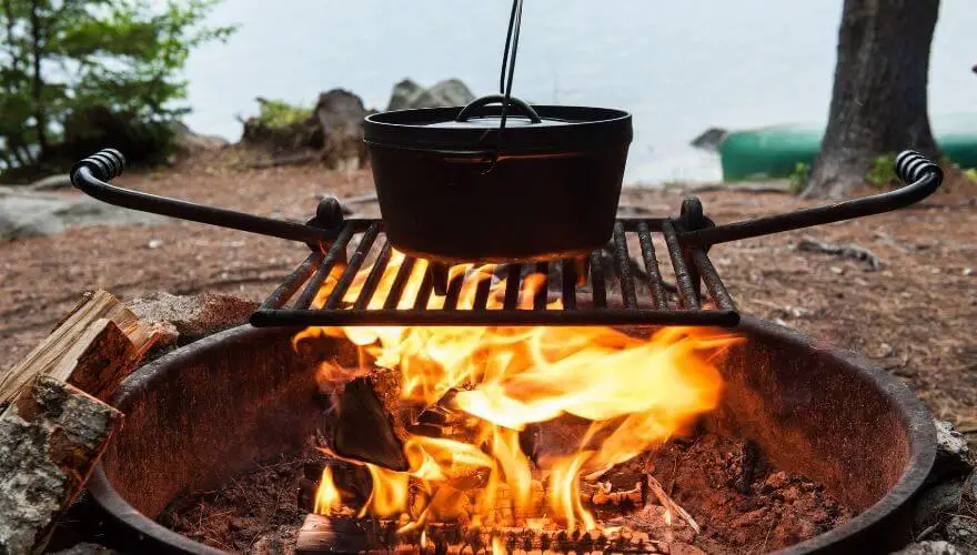 Cooking over a campfire with a dutch oven